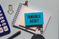 Tangible Asset text written on a notebook with pencils Royalty Free Stock Photo