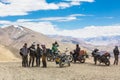 Tanglang La, India - July 22 2014: A group of bikers takes a break on the summit of the Tanglang La pass over 5300m high in Royalty Free Stock Photo