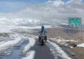 TANGLANG LA PASS, LADAKH , INDIA JULY 20, 2015: Biker on the summit of the Tanglang La pass is the second highest motorable road