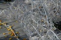 A tangle of Christmas decorative chains surrounds the wire skeletons of reindeer and sleighs. technology of fastening on stainless Royalty Free Stock Photo