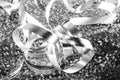 A tangle of curling glowing silver gift ribbon. Royalty Free Stock Photo