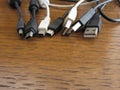 Tangle of dusty computer cables with sockets on the table Royalty Free Stock Photo