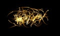 A tangle of fiery glowing lines.Flying fire sparks. Abstract background