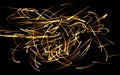 A tangle of fiery glowing lines.Flying fire sparks. Abstract background