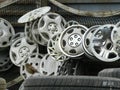 Tangle of hubcaps on a fence Royalty Free Stock Photo