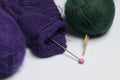Tangle thread for knitting. Knitting needles are stuck into it.