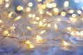 A tangle of white string lights shines brightly