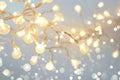 A tangle of white string lights shines brightly
