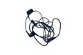 Tangled black headphones lie on a white background. Royalty Free Stock Photo