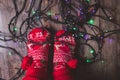 Tangled Christmas lights at feet on floor Royalty Free Stock Photo