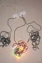 Tangled Christmas lights on floor elevated view