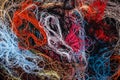 Tangled colorful sewing threads background