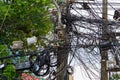 Tangled electrical wires in Thailand. Royalty Free Stock Photo