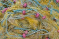 Tangled fishing nets and floats close-up on the shore