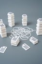 A tangled line in a circle of stacks of papers and documents. Bureaucratic hell, paperwork overload Royalty Free Stock Photo