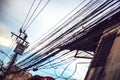 Tangled and messy electrical cables in Bangkok city, Thailand Royalty Free Stock Photo