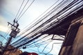 Tangled and messy electrical cables in Bangkok city, Thailand