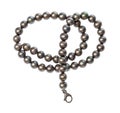 Tangled necklace from black pearls isolated