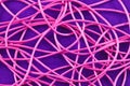 Tangled pink knitting threads