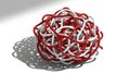 Tangled Red and White Wires Creating a Complex Knot on a White Surface Royalty Free Stock Photo