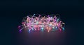 Tangled String of Colorful LED Lights on Dark Background Royalty Free Stock Photo