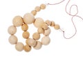 Tangled string of wooden beads isolated