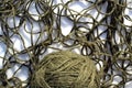 Tangled threads with a ball lie on a white background. Royalty Free Stock Photo