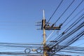 Tangled wire on electricity pole in the city