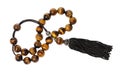 Tangled worry beads from tiger`s eye gems isolated