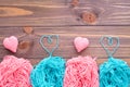 Tangles of pink and mint yarn and knitting hearts