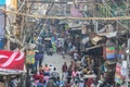 Tangles of utility wires above a busy street in the city of Delhi, India.