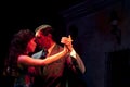 Tango Dancers at Night in Street of Buenos Aires, Argentina. Street Life, Couple Dancing Close Together, Head on Head. Royalty Free Stock Photo