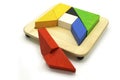 Tangram, Chinese traditional puzzle game made of different colorful wooden pieces that come together in a distinct shape Royalty Free Stock Photo