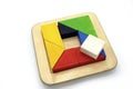 Tangram, Chinese traditional puzzle game made of different colorful wooden pieces that come together in a distinct shape Royalty Free Stock Photo