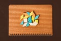 Tangram puzzle shape on brown notebook, use for business and education concept Royalty Free Stock Photo