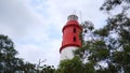 Tanjung Kalian lighthouse tower, in red and white colors, in Muntok City - Indonesia