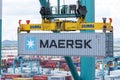 Maersk owned container loaded by the gantry crane on the container ship.