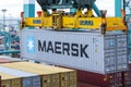 Maersk owned container loaded by the gantry crane on the container ship.