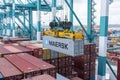 Maersk owned container loaded by the gantry crane on the container ship.