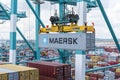 Maersk owned container loaded by the gantry crane on the container ship.