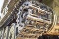 Tank caterpillar track with wheels. Caterpillar armored vehicle. Close-up