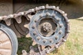 Tank caterpillar tread continuous track with drive sprocket wheel close up