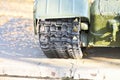 Tank caterpillars close-up. Iron caterpillars of the military heavy tank. Iron caterpillars and wheels of the military heavy tank