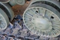 Tank caterpillars close-up. Iron caterpillars of the military heavy tank. Iron caterpillars and wheels of the military heavy tank