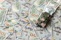 Tank on crumpled hundred dollar bills banknotes. Background of war funding and military support Royalty Free Stock Photo