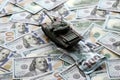 Tank on crumpled hundred dollar bills banknotes. Background of war funding and military support Royalty Free Stock Photo
