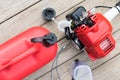 Tank for dressing and lawn mowing equipment lie on a light background close up Royalty Free Stock Photo