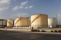 Tank farm, large white industrial tanks for petrol and oil Royalty Free Stock Photo