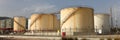 Tank farm, large white industrial tanks for petrol and oil Royalty Free Stock Photo