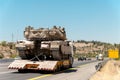 Tank Merkava carrier truck on the highway during the war in Israel Royalty Free Stock Photo